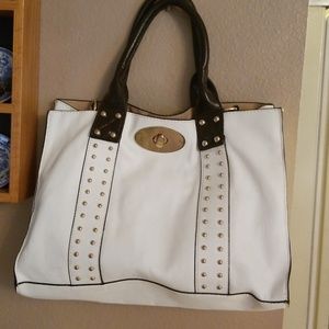 White purse with Black  trim  & gold studs
